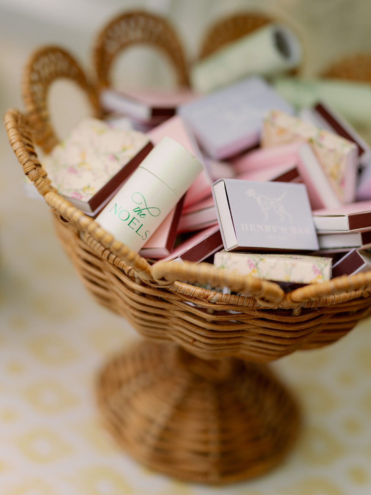 Wicker basket of custom matchbooks for Mia and John's Dallas wedding by Magnolia Boone Paperie